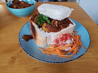 Bunny chow served in a bread loaf