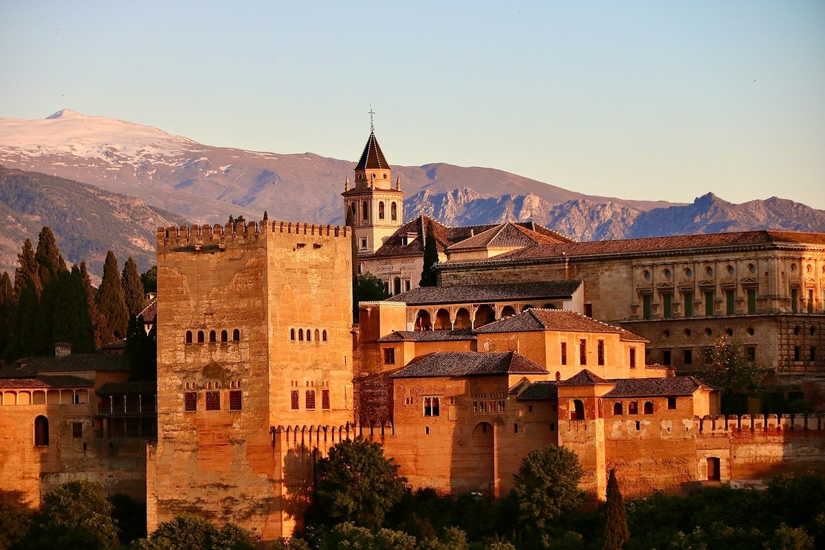 The Alhambra complex in Granada, Spain, illuminated by evening light