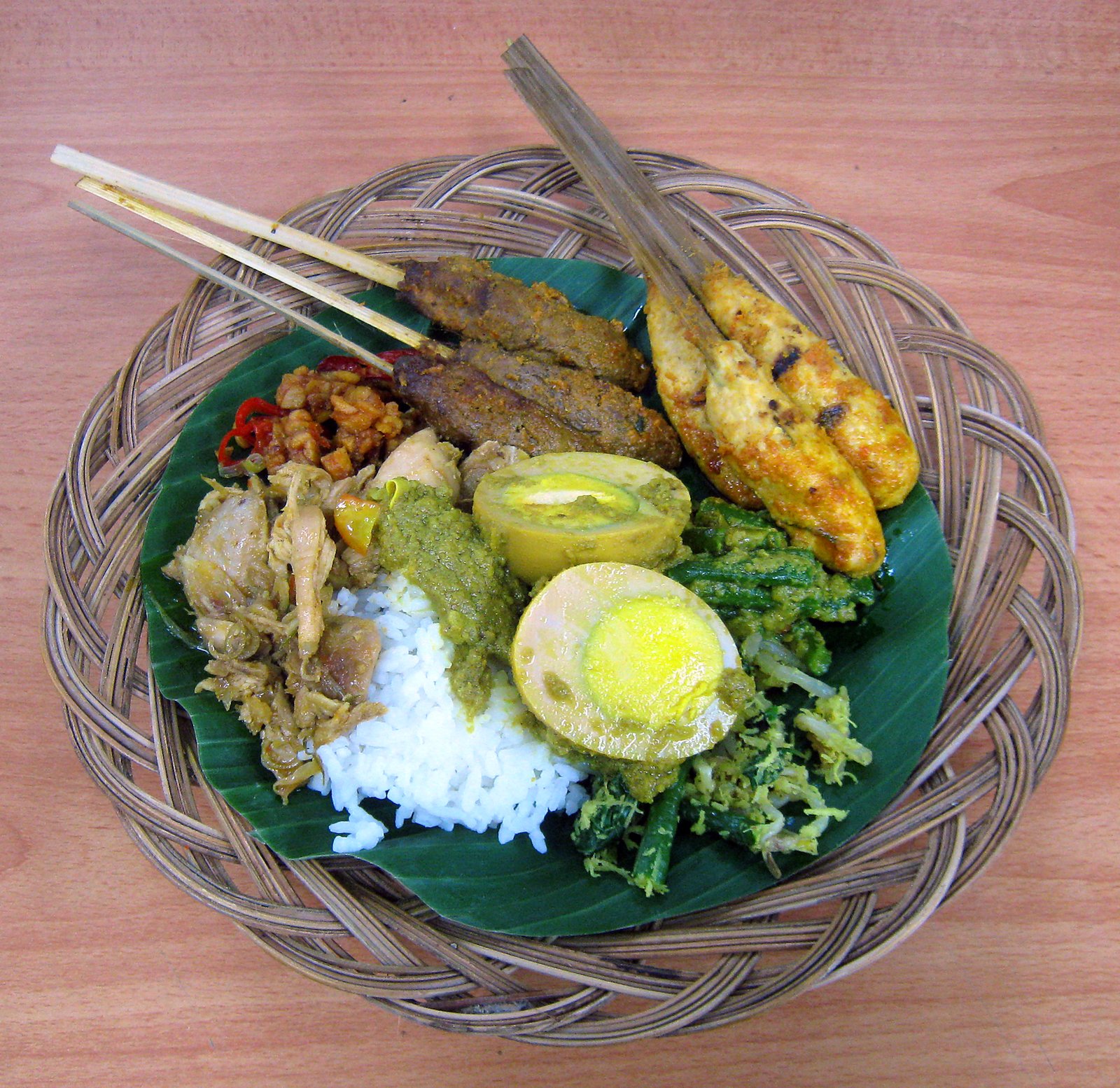 Balinese nasi campur with sate lilit and side dishes