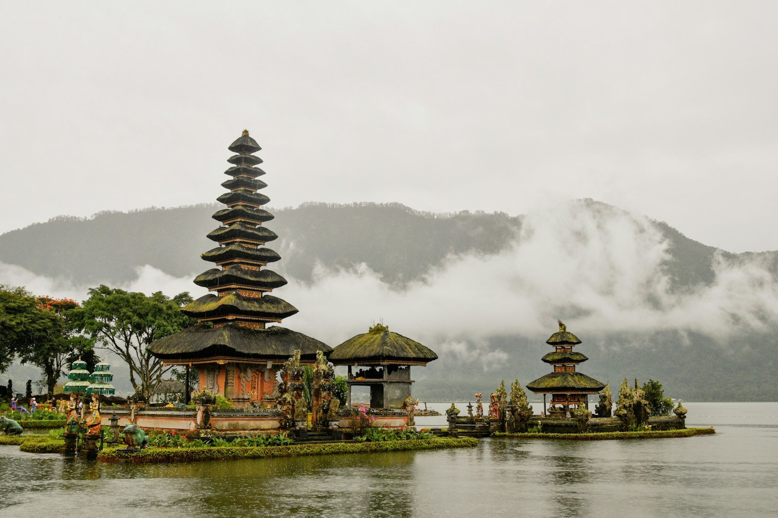 Balinese water temple with multi-tiered shrines on a lake