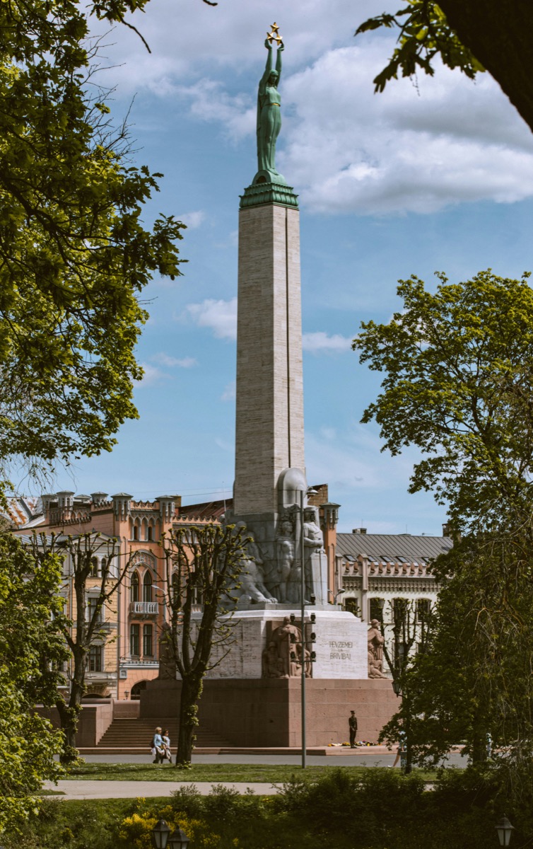 Freedom Monument in Riga with Liberty holding three golden stars