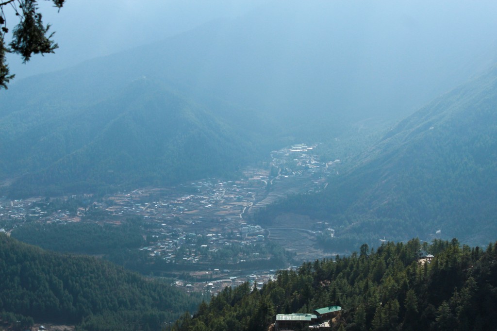 Misty Paro Valley nestled between forested mountains in Bhutan
