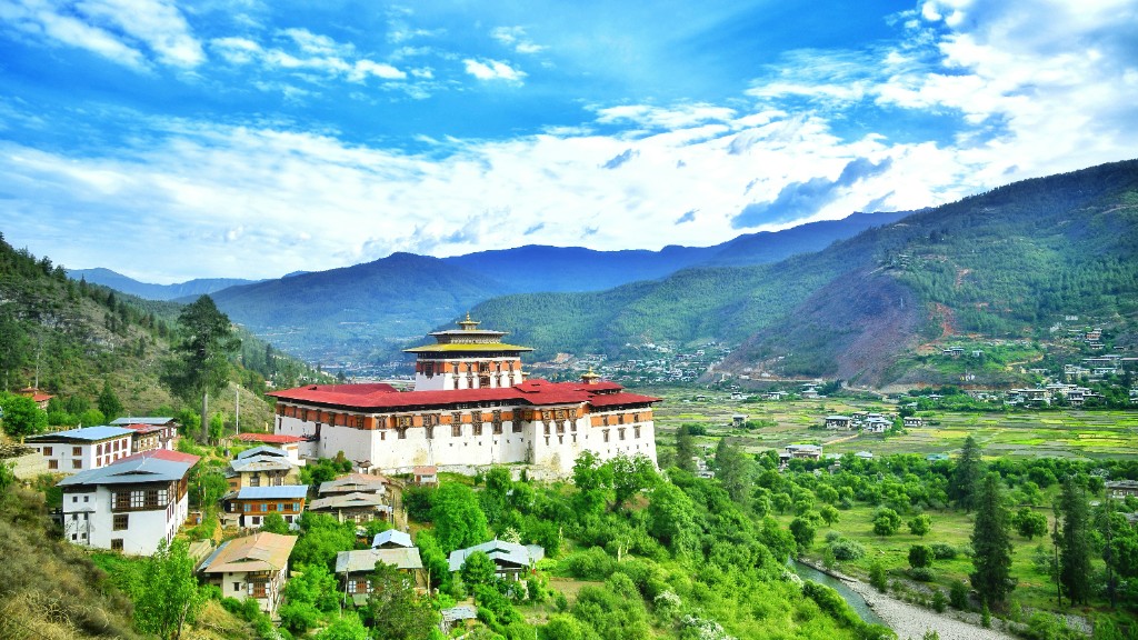 Rinpung Dzong with white walls and red roofs above the Paro Valley