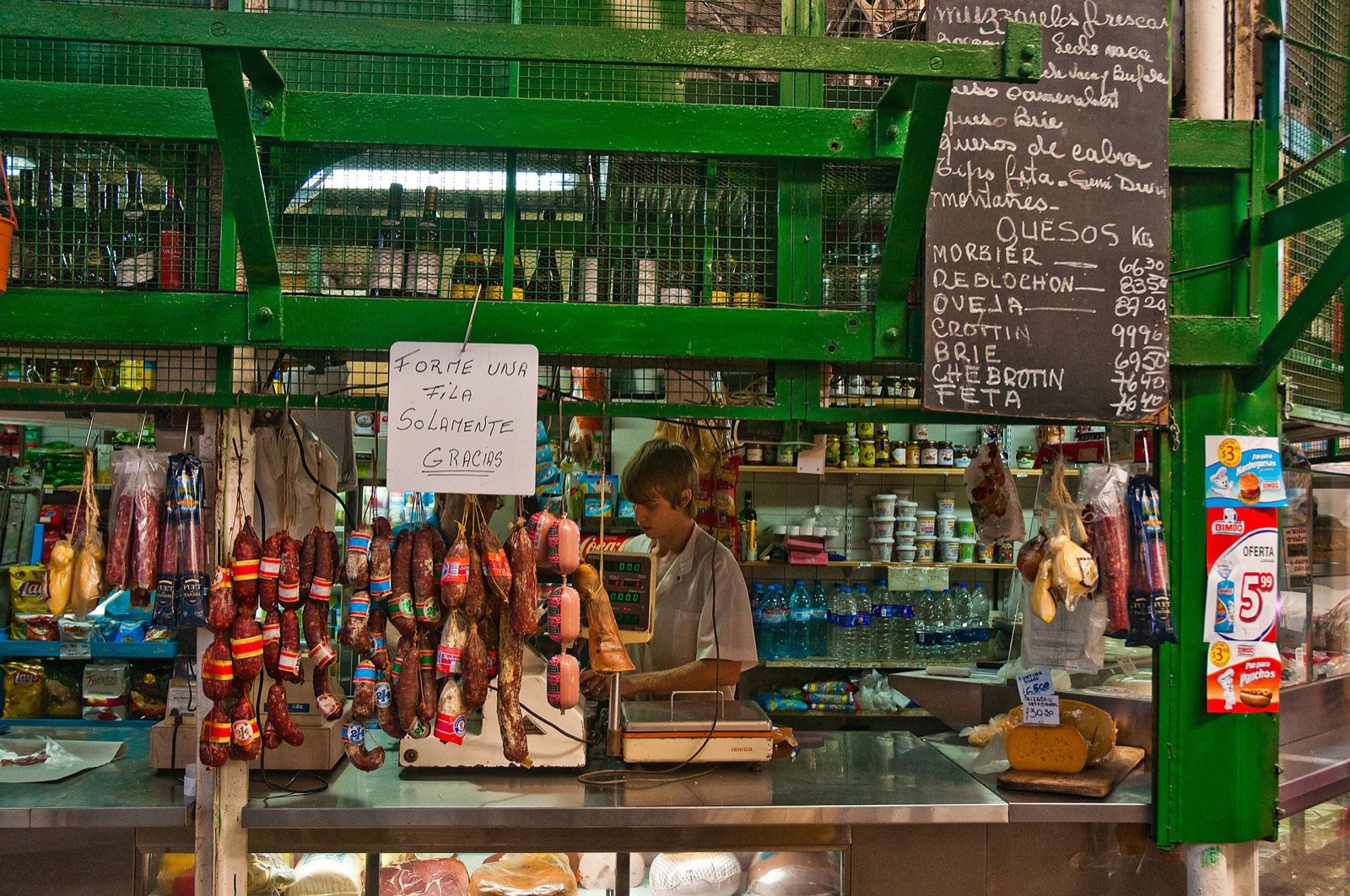Crowds browsing stalls at the San Telmo Fair along a Buenos Aires street