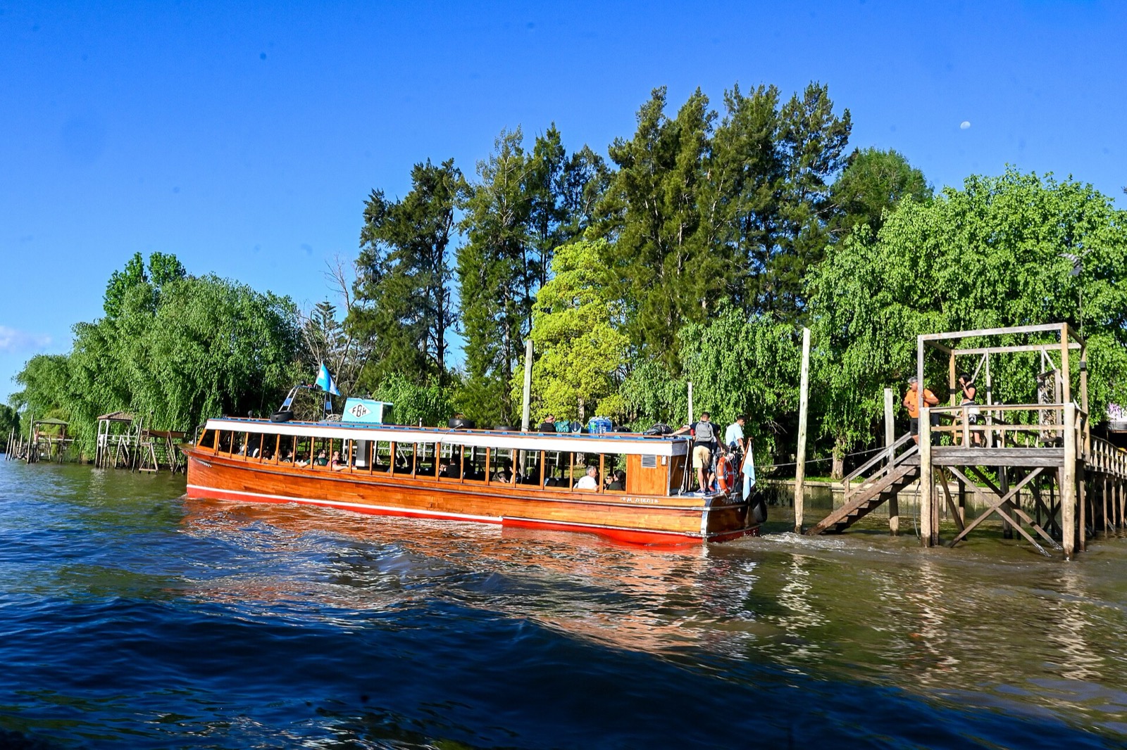 Boats and tree-lined canals in the Tigre Delta near Buenos Aires
