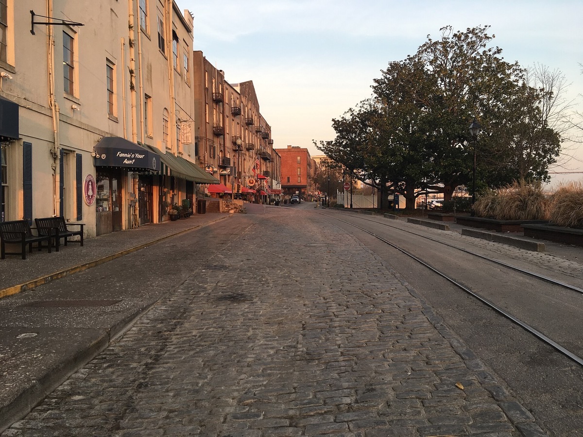 Historic warehouses and boats along Savannah’s River Street waterfront