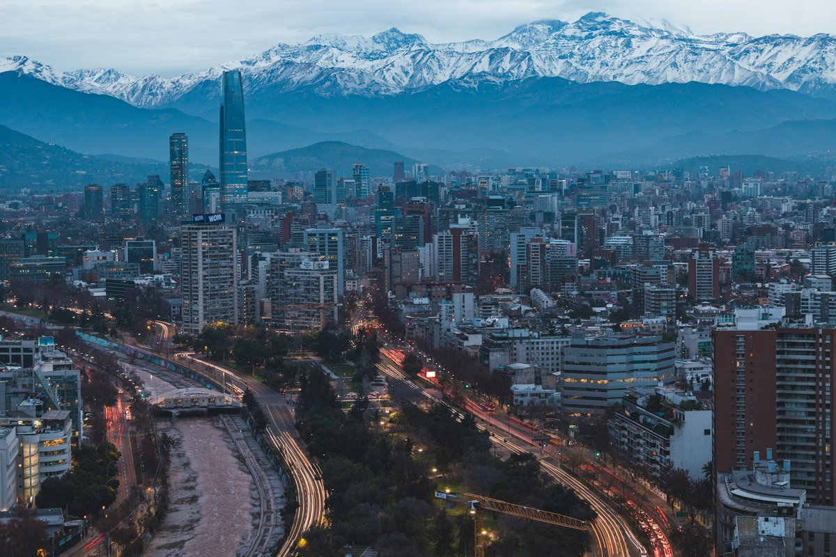 Santiago viewed across the city with the Andes rising behind high-rise buildings