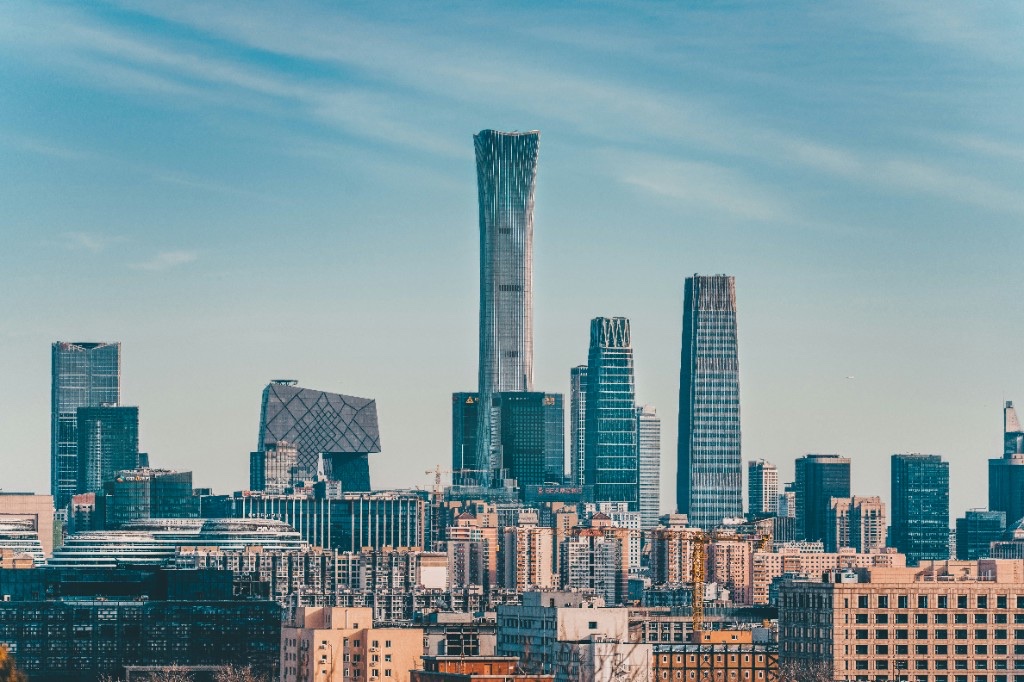 Beijing skyline with China Zun and CCTV Headquarters under a clear blue sky