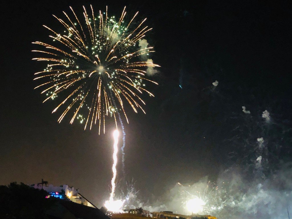 A firework bursting in the night sky over Cartagena on New Year's Eve