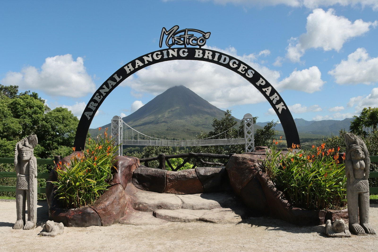 Entrance to the Arenal hanging bridges park with a mountain in the background
