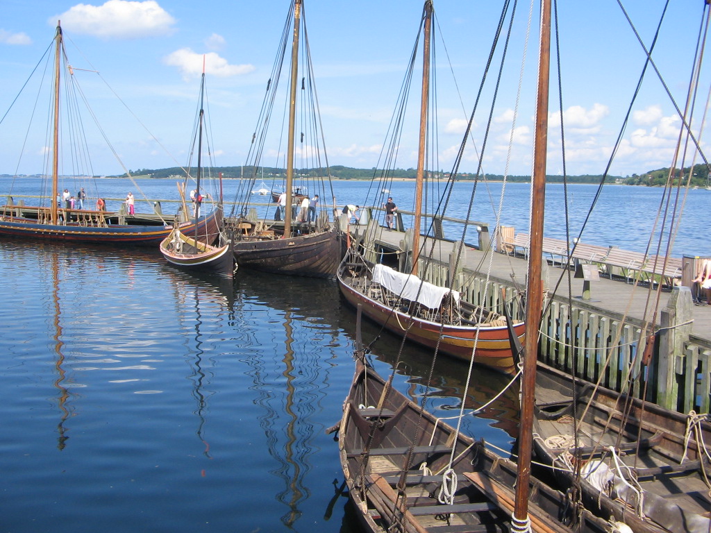 Replica Viking ships moored at the Viking Ship Museum harbour in Roskilde