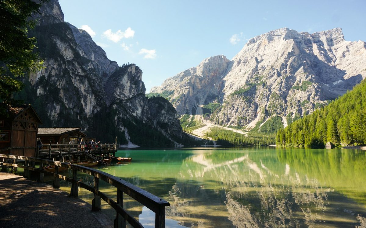 Lago di Braies in Italy, with dramatic Dolomite peaks reflected across the lake