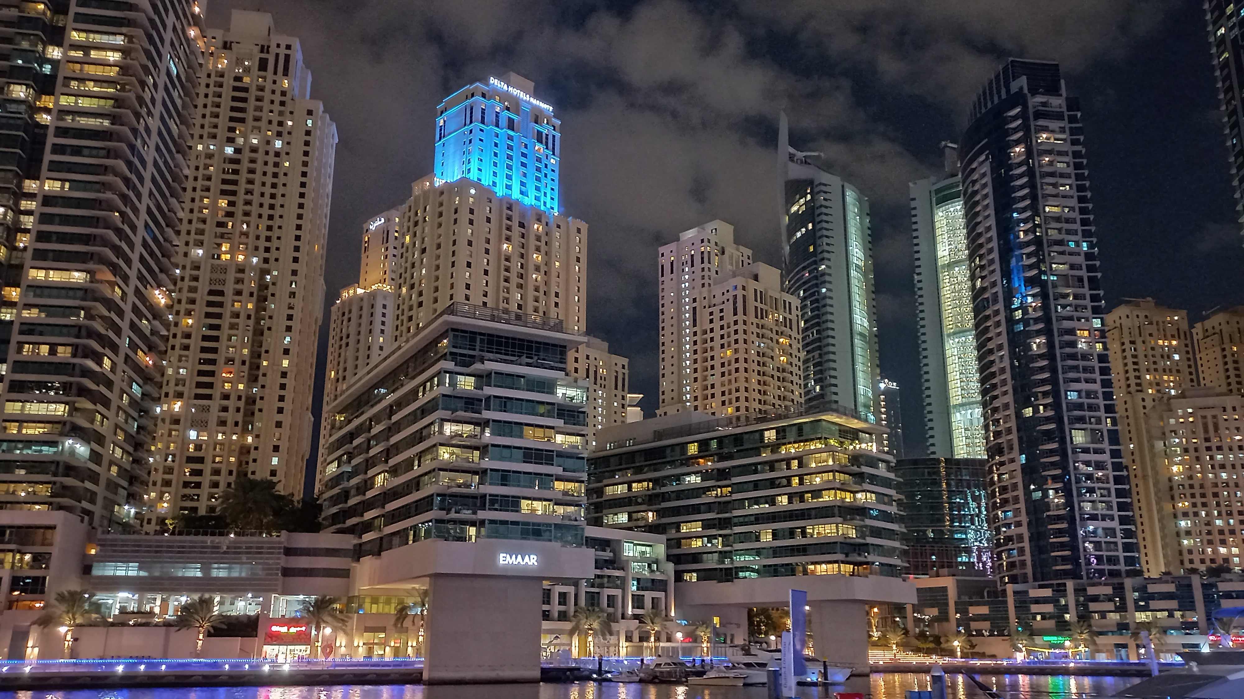 Dubai Marina skyline at night with waterfront and towers