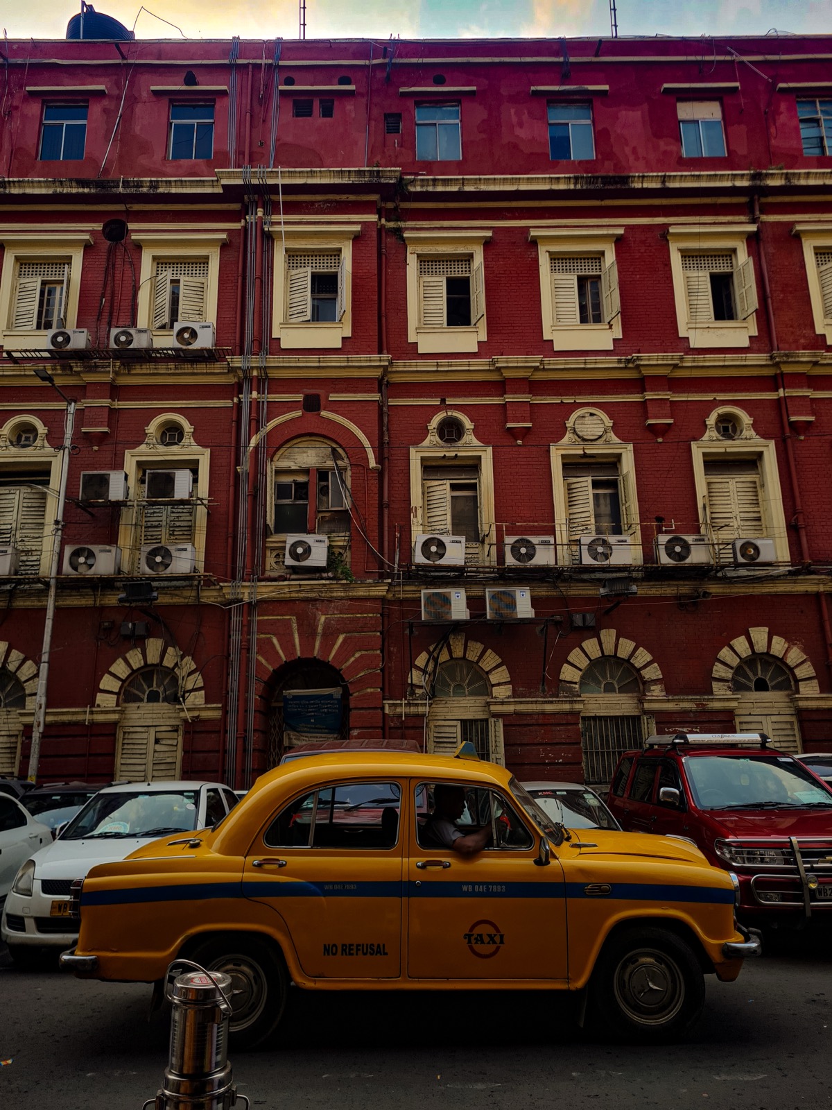 Yellow Ambassador taxi outside New Market in Kolkata