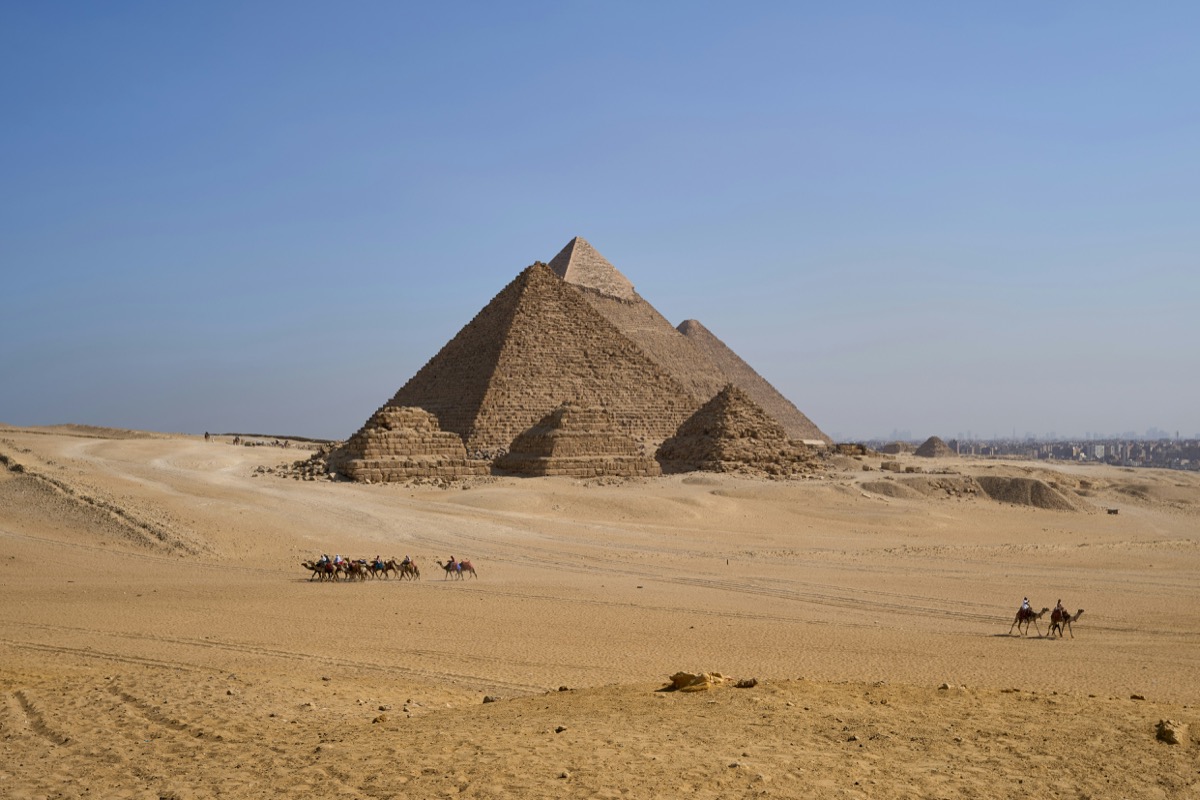 Camel riders in front of the Great Pyramid of Giza