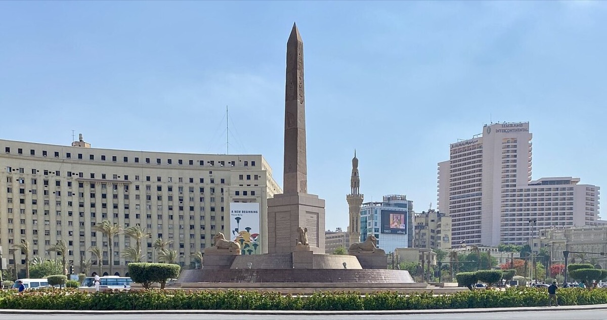 Tahrir Square in Cairo surrounded by buildings and traffic