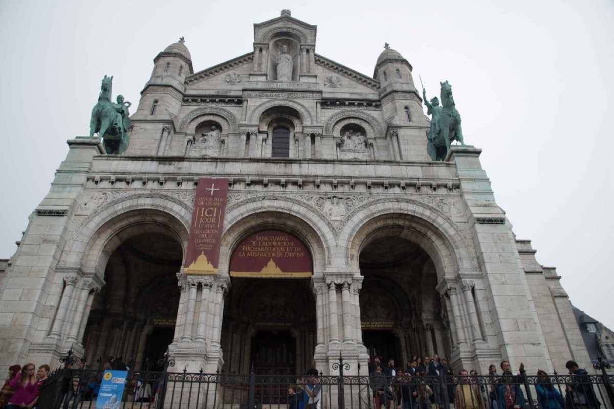 The facade of Sacre-Coeur Basilica in Montmartre seen from the base of the steps