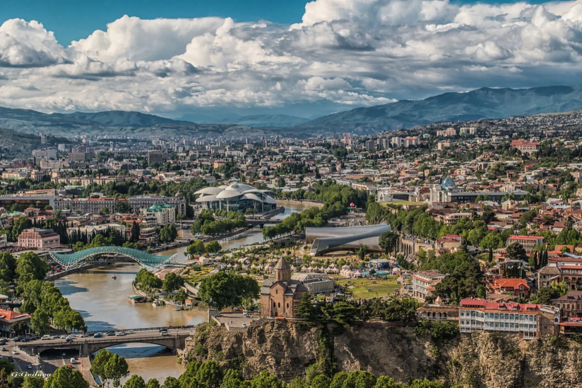 Old Tbilisi with historic buildings and mountain backdrop