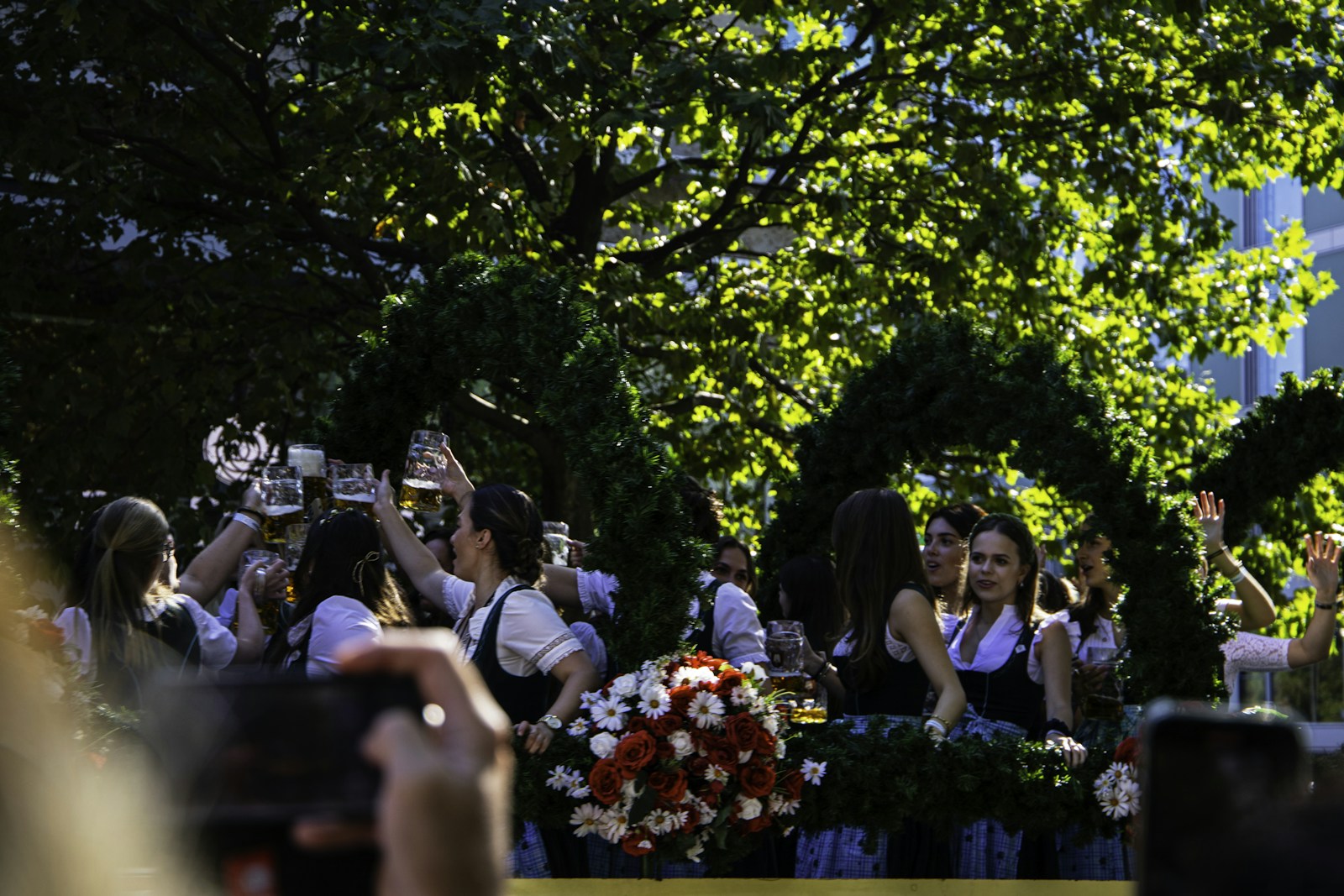 People in traditional Bavarian clothing celebrating in Munich