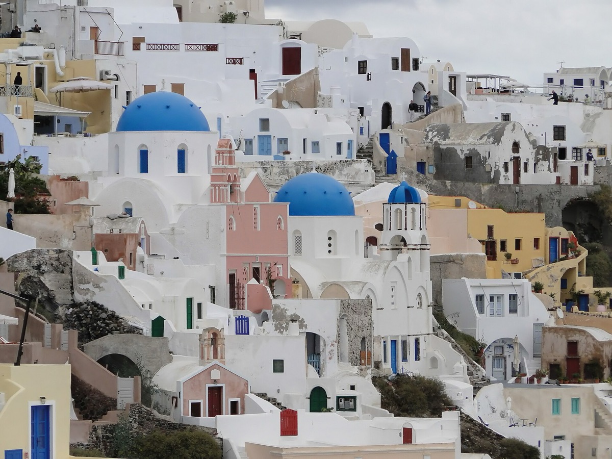 Caldera-facing whitewashed lanes and houses in Oia, Santorini