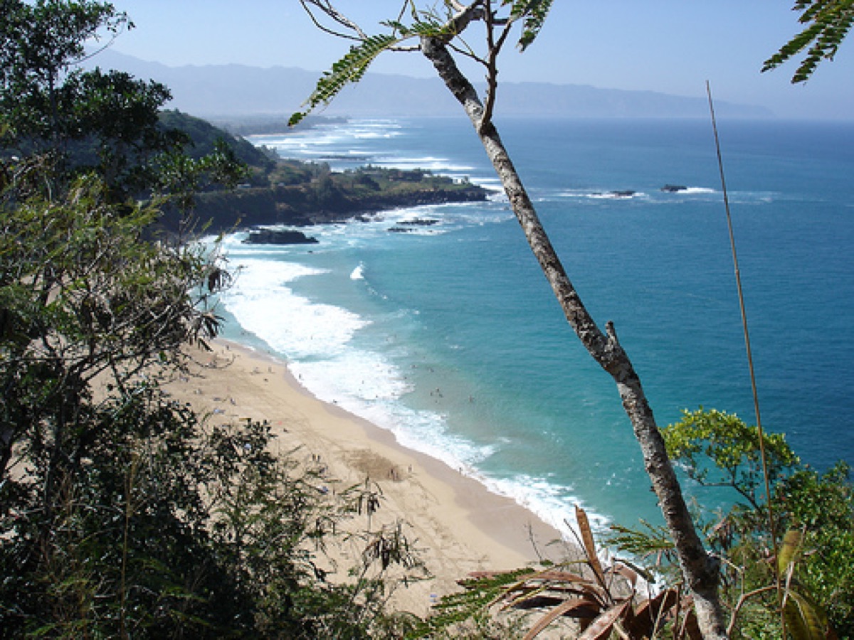 Waimea Bay on Oahu's North Shore with blue Pacific water and a sandy cove