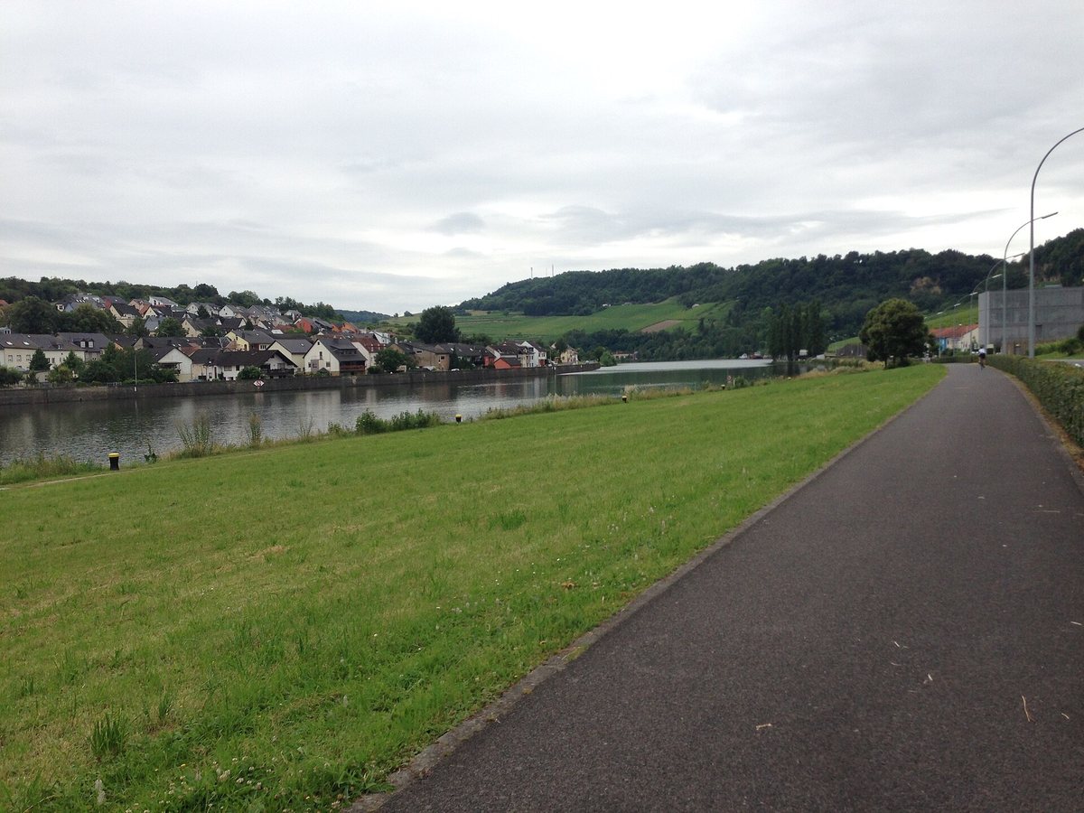 The Moselle River in Grevenmacher, Luxembourg, with surrounding hillside villages