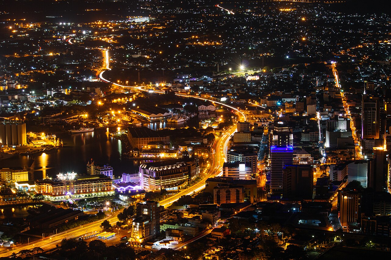 Port Louis, Mauritius at night with city lights and harbour