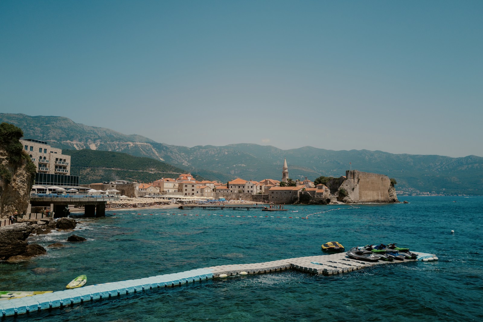Coastal view of Budva with the historic Old Town and boats on the water