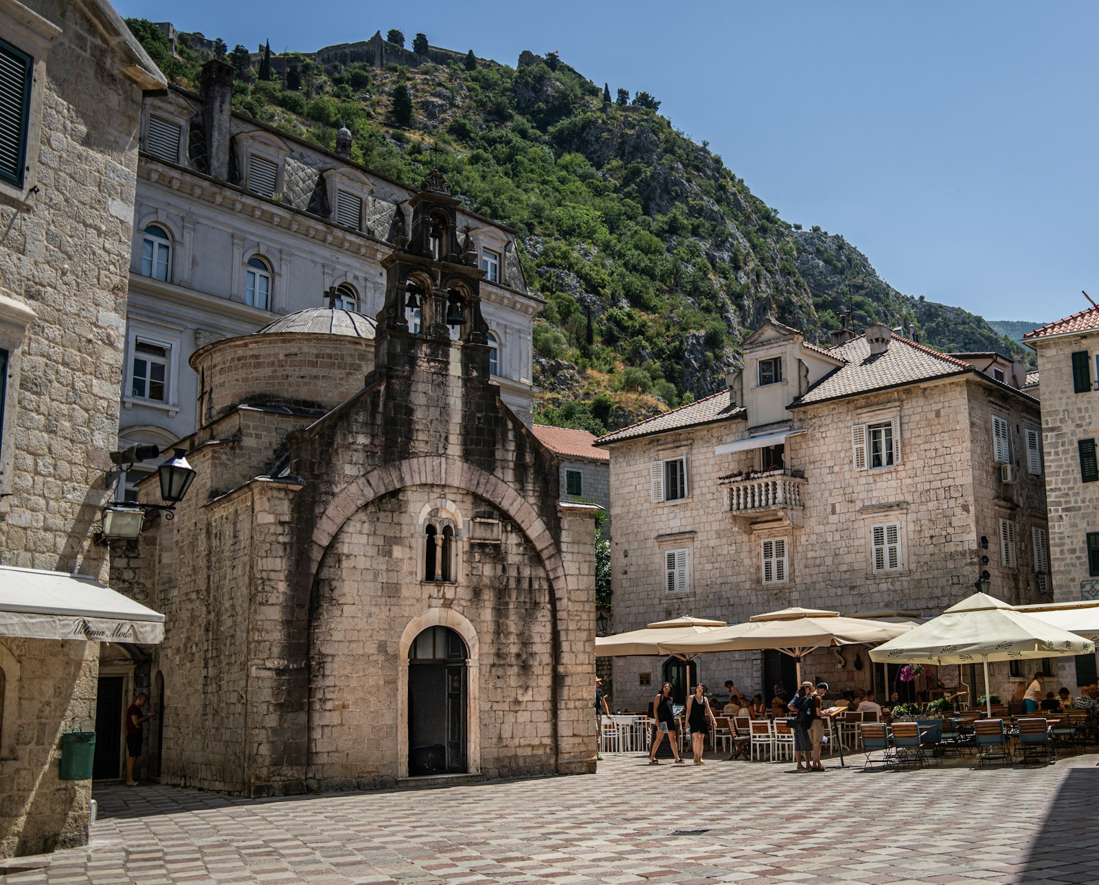 Kotor with the historic stone architecture of the old town set beneath the rugged mountains surrounding the Bay of Kotor