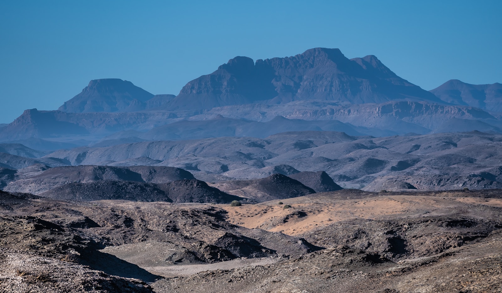 Rugged rocky mountains and arid plains across Damaraland, Namibia