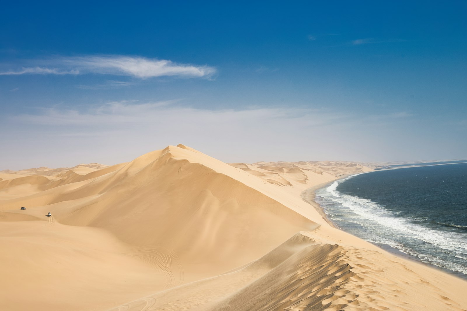 Sandy Namib coastline where desert dunes meet the Atlantic Ocean