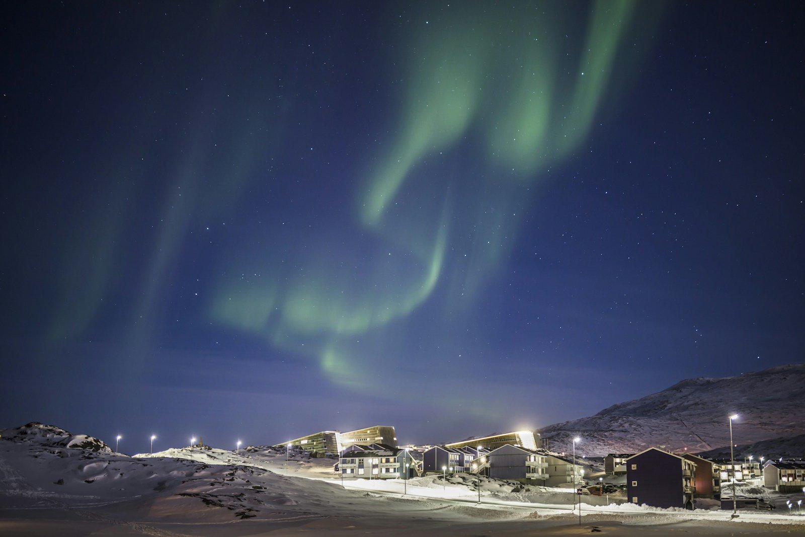 Northern lights over houses in Nuuk, Greenland