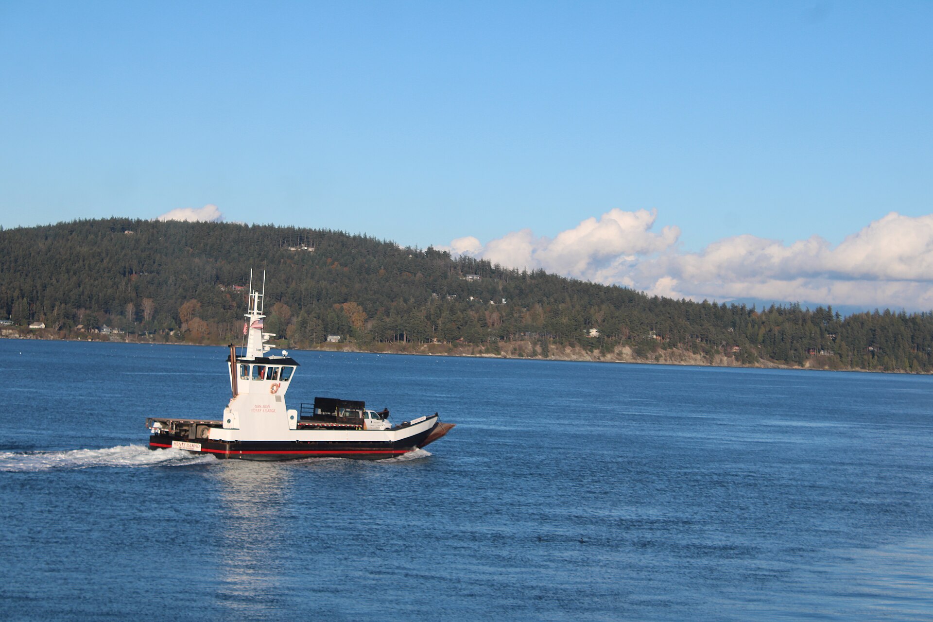 A ferry sailing towards the San Juan Islands through the waters of the Salish Sea