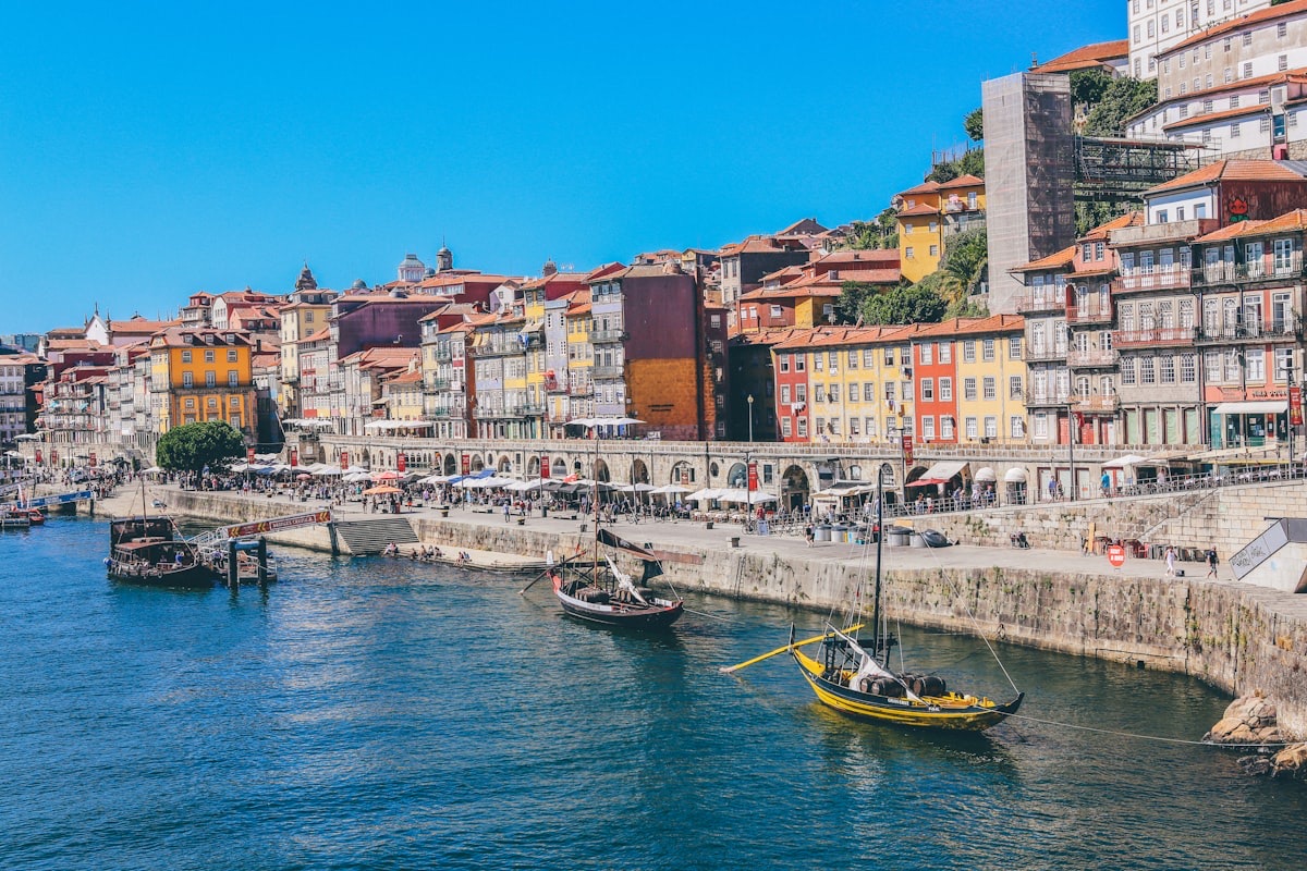 Aerial view of Lisbon's Alfama district with red rooftops overlooking the Tagus River