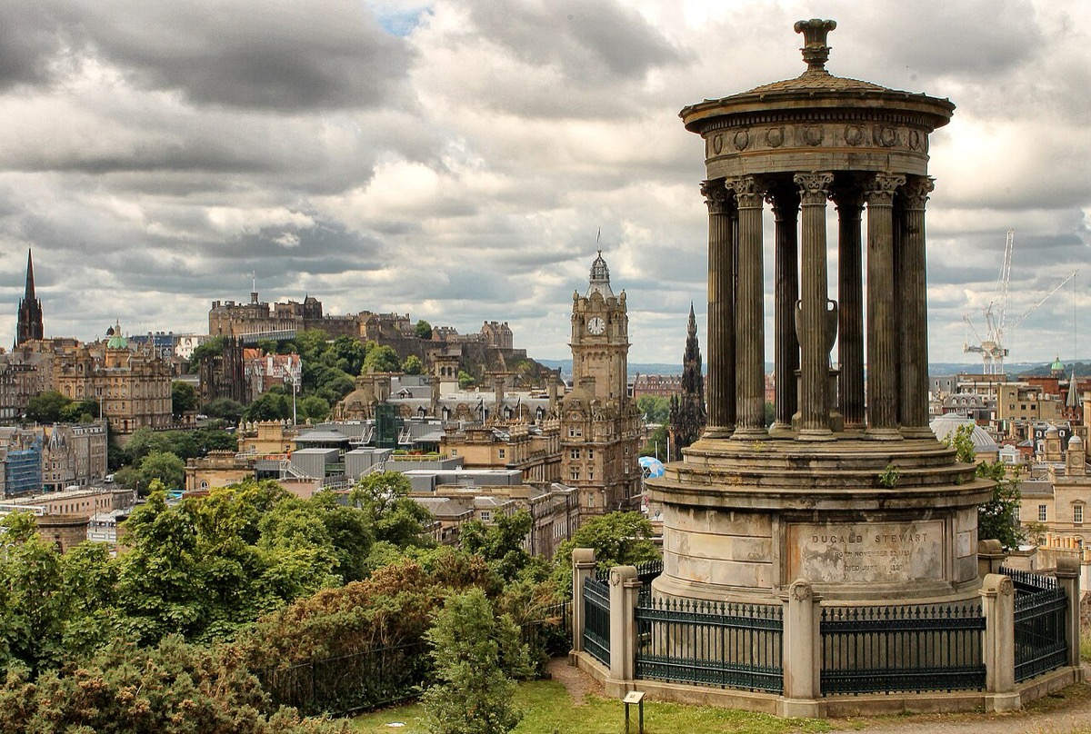 The Dugald Stewart Monument on Calton Hill overlooking Edinburgh's skyline