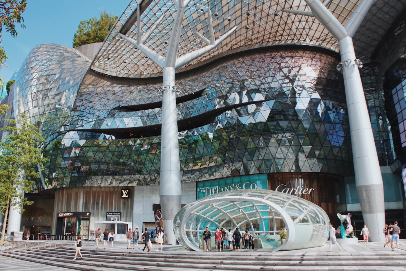Shoppers and pedestrians near buildings on Orchard Road, Singapore