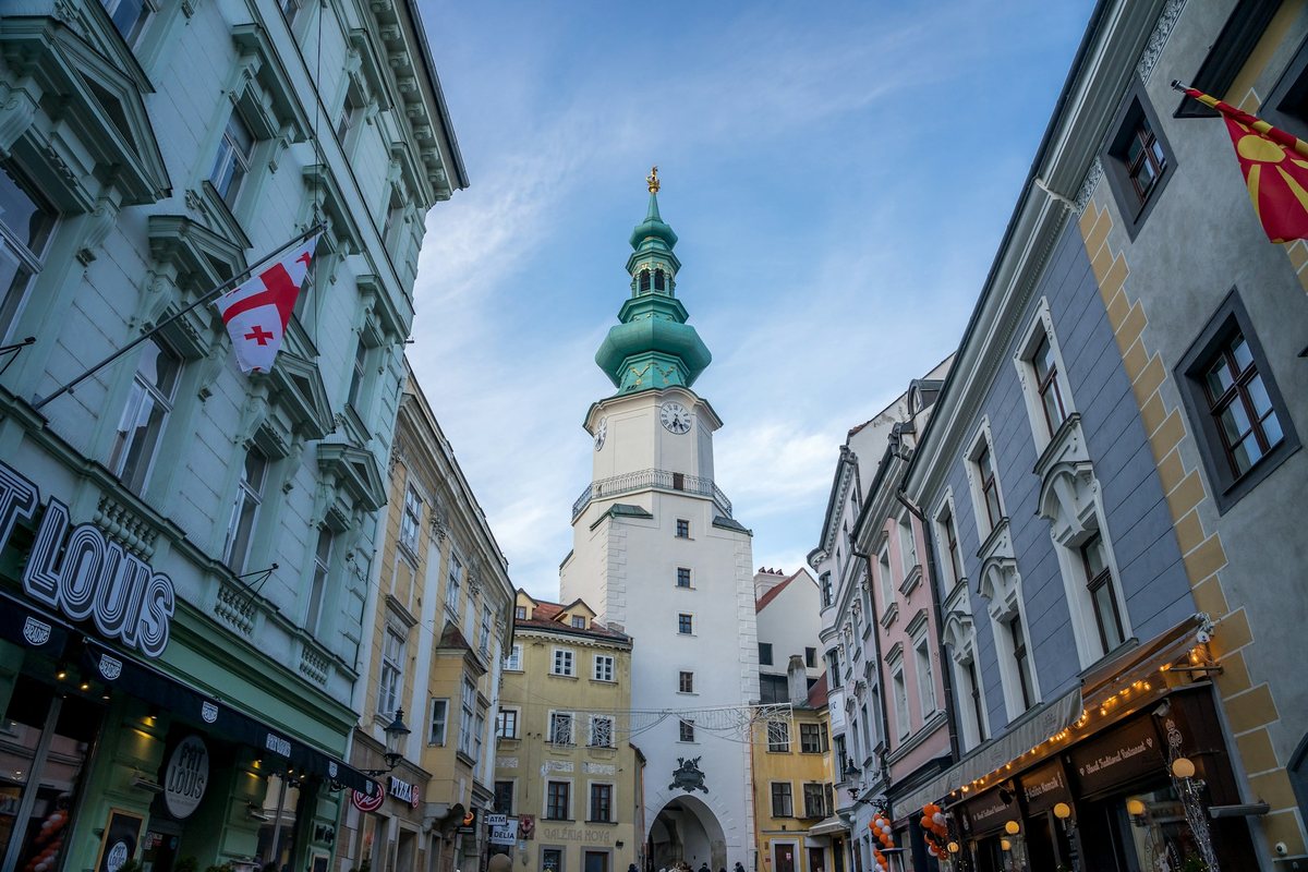Michael's Gate, the historic city gate in Bratislava's Old Town, surrounded by colorful historic buildings