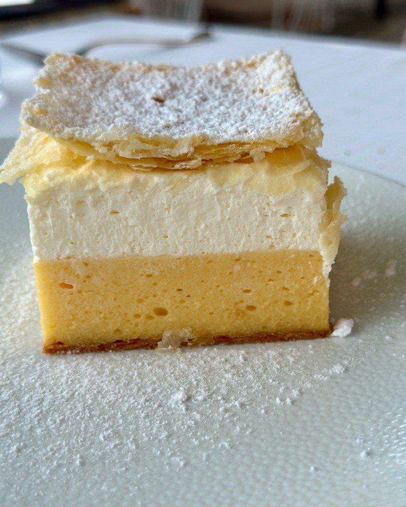 Slice of Bled cream cake, blejska kremšnita, with custard, cream and flaky pastry