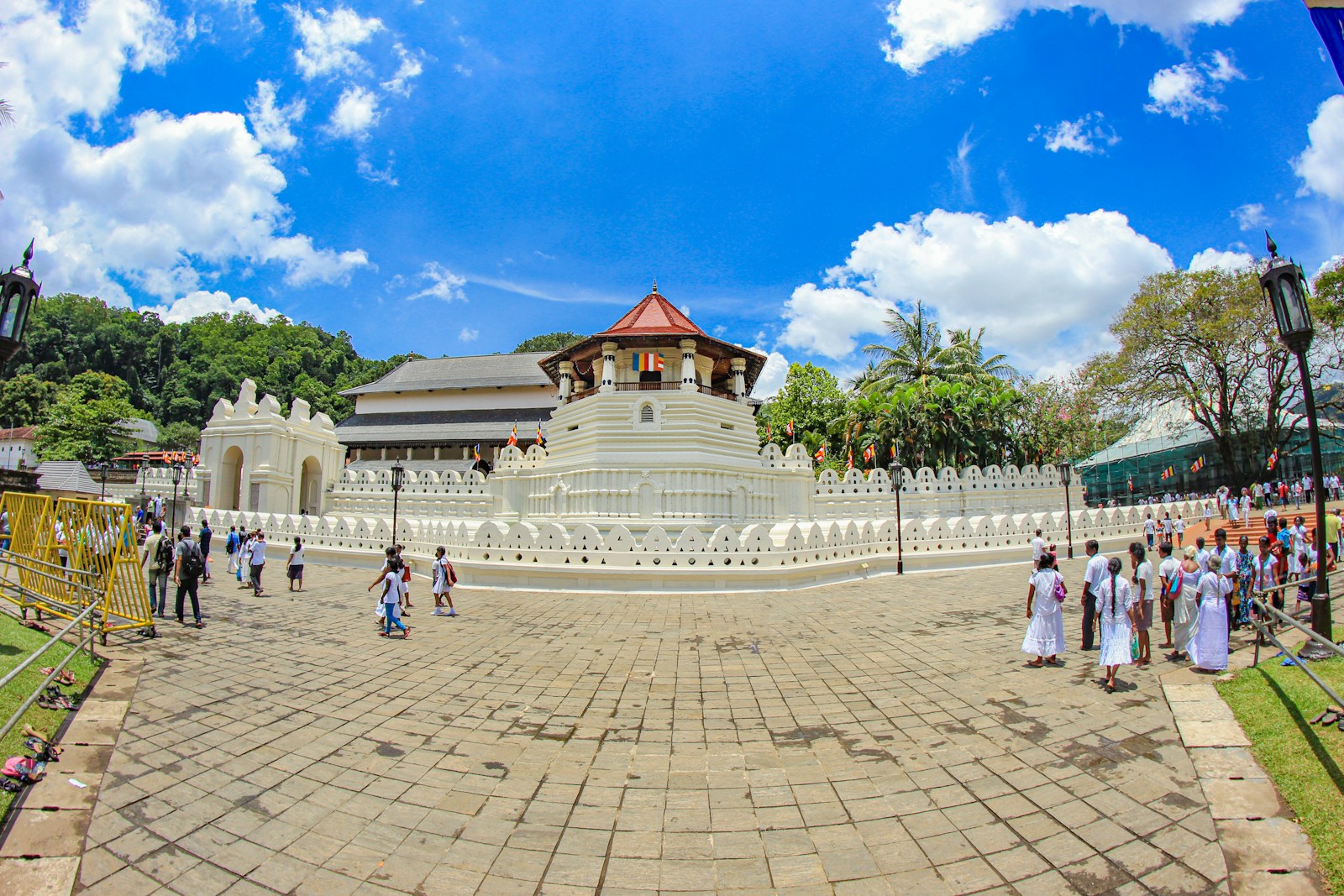 Visitors walking through the Temple of the Sacred Tooth Relic complex in Kandy