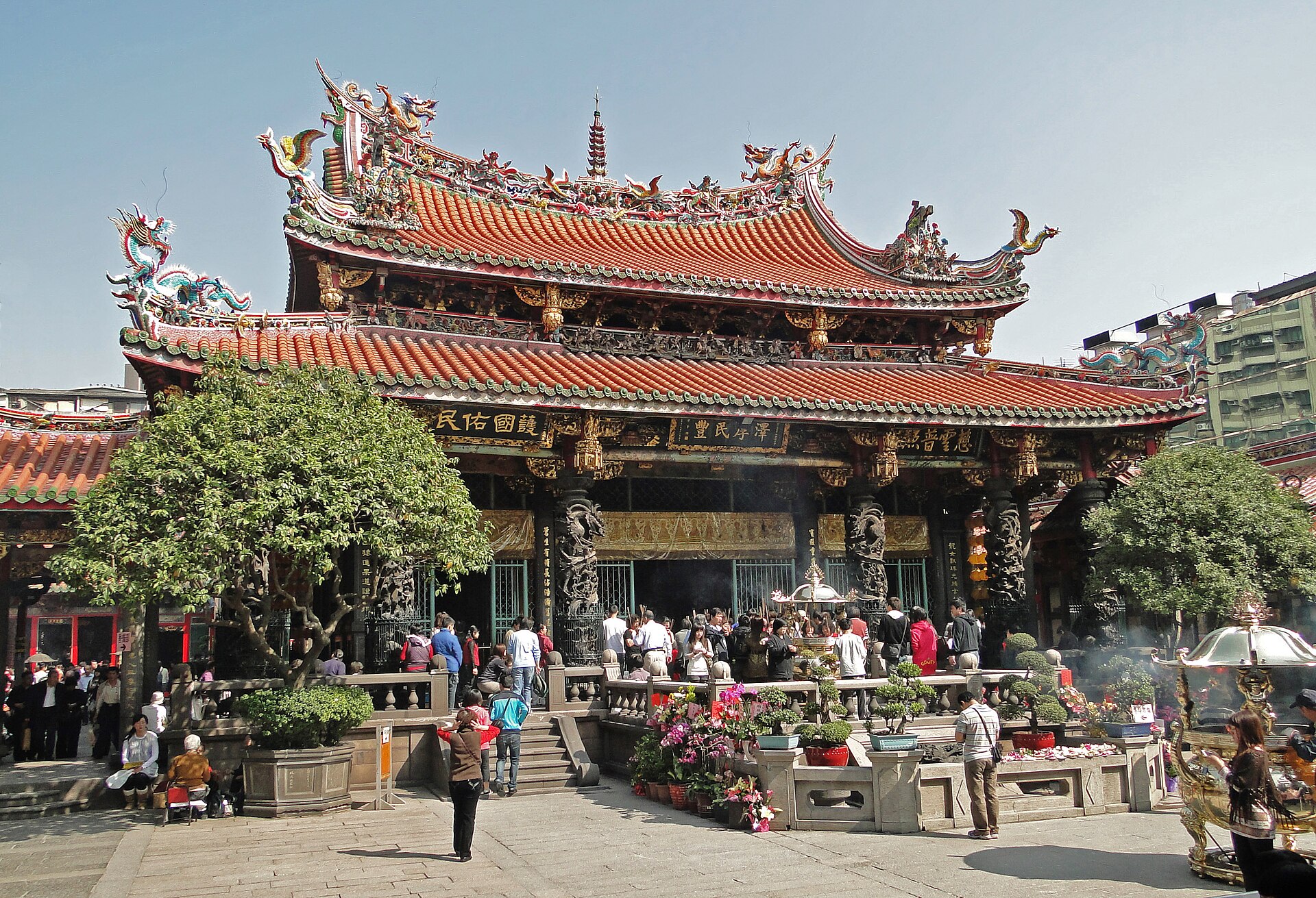 Longshan Temple in Taipei with traditional Chinese architecture and red doors