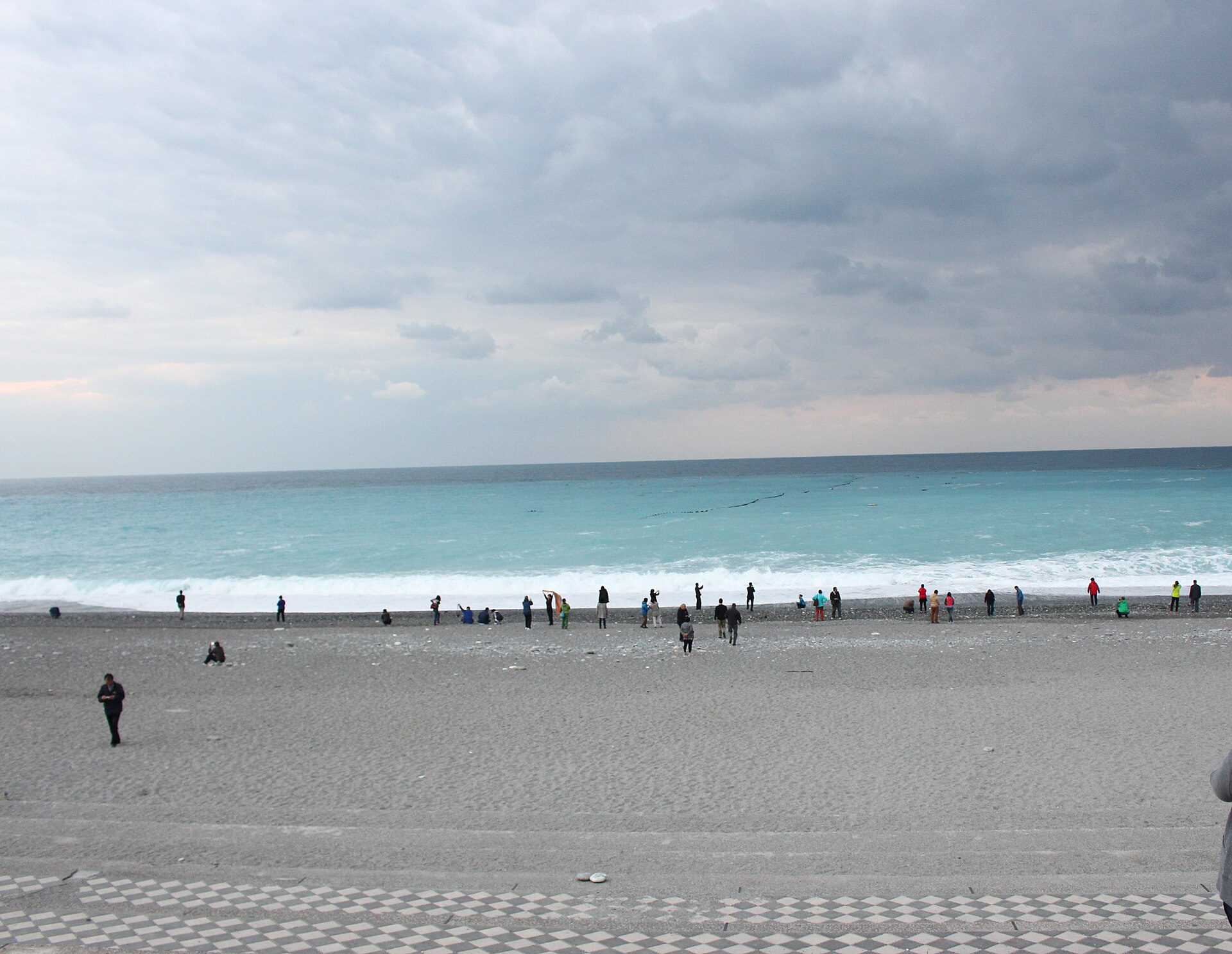 Qixingtan beach in Hualien with rocky shoreline, Pacific Ocean and mountains