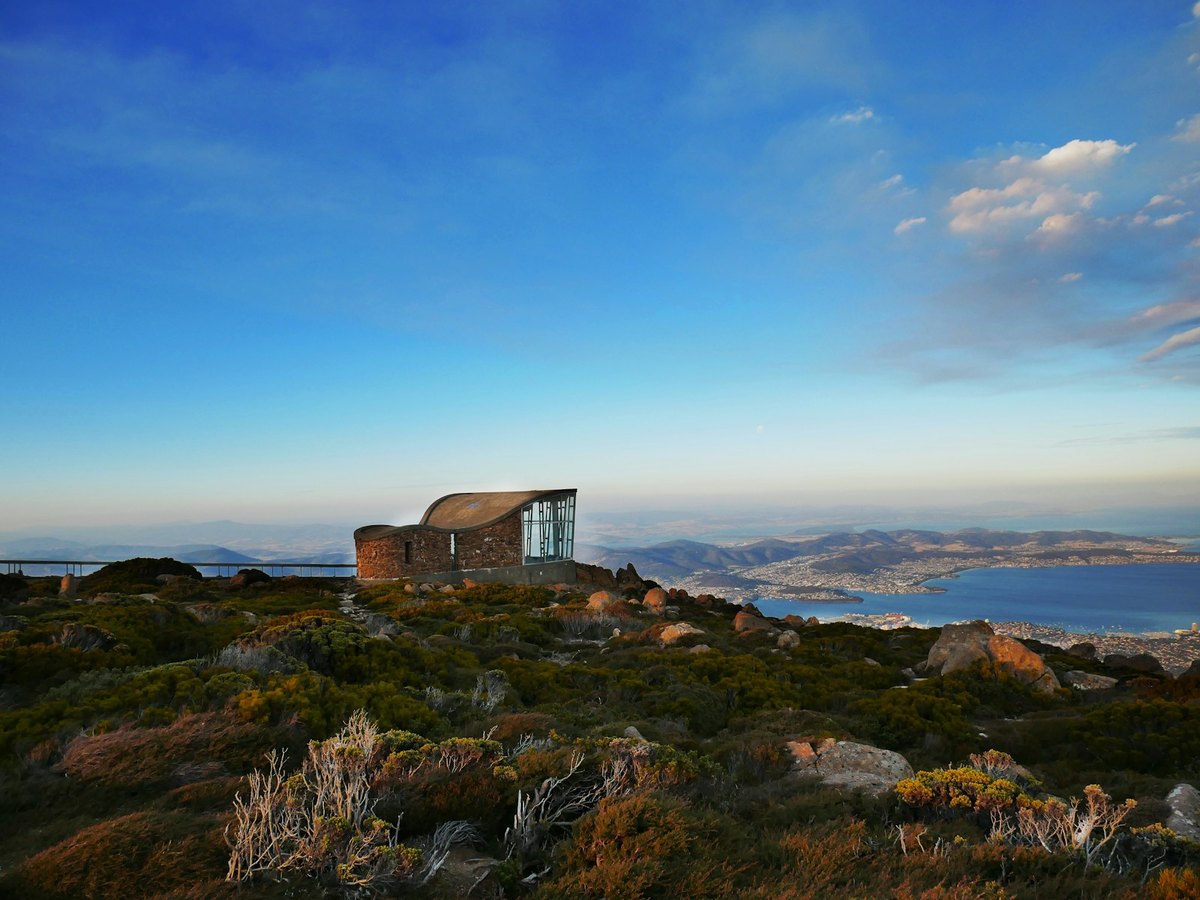 Mount Wellington at sunset, with the observation building and Hobart visible in the distance