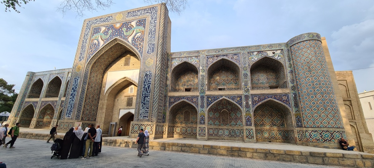 Lyabi-Hauz ensemble in Bukhara with madrasas reflected in a historic pool