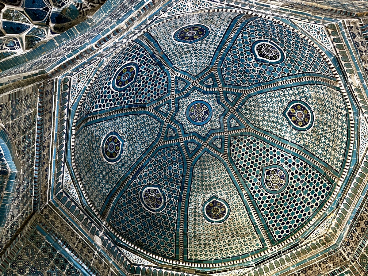 Intricate turquoise tilework on a dome at Shah-i-Zinda in Samarkand