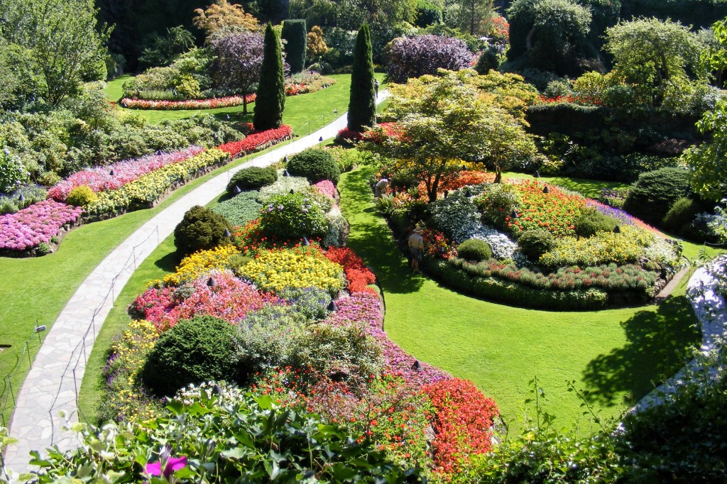Colourful flower beds and pathways in the Sunken Garden at Butchart Gardens in Victoria