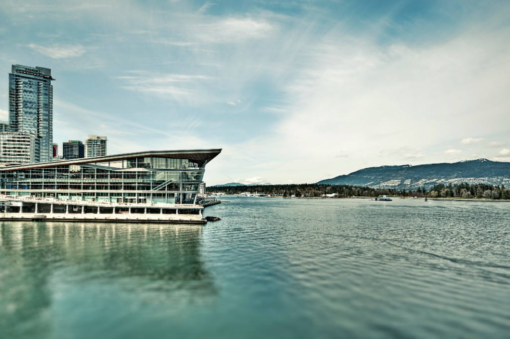 Vancouver Convention Centre along the waterfront with harbour waters in the foreground
