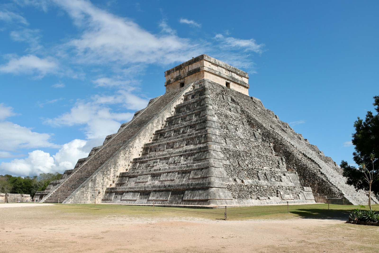 El Castillo, the main pyramid at Chichén Itzá, rising from a grassy plaza